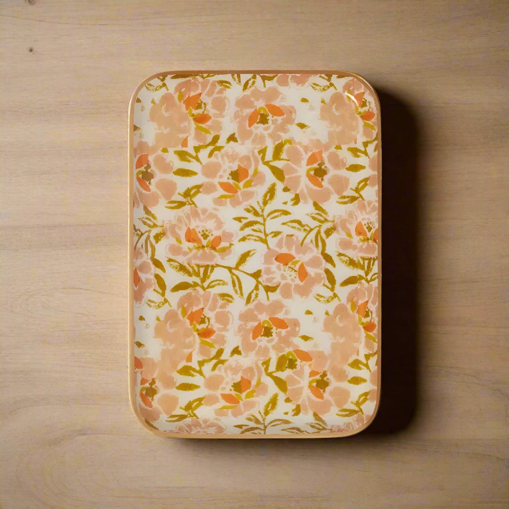 Floral-patterned tray with peach and green flowers on a white background