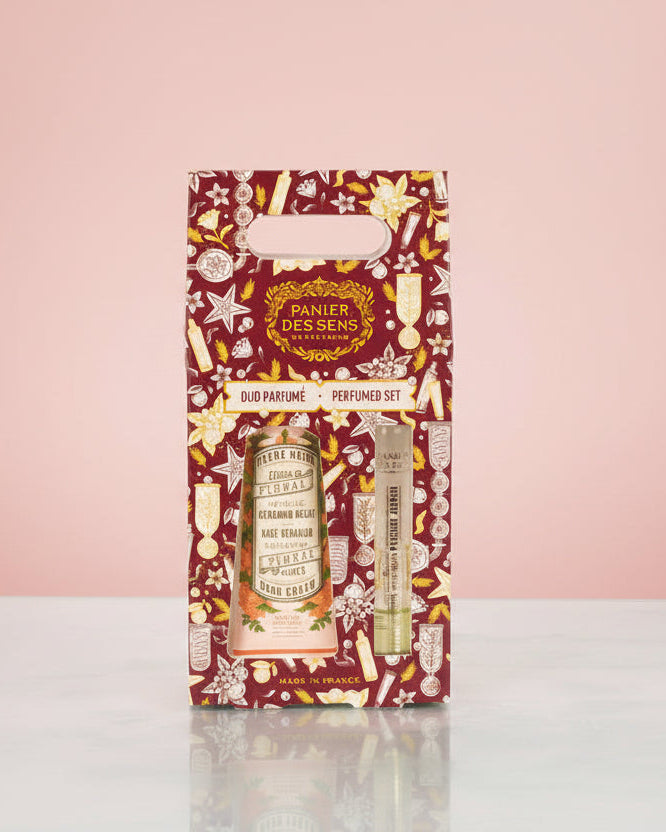 Perfume set packaging with floral design on a white background