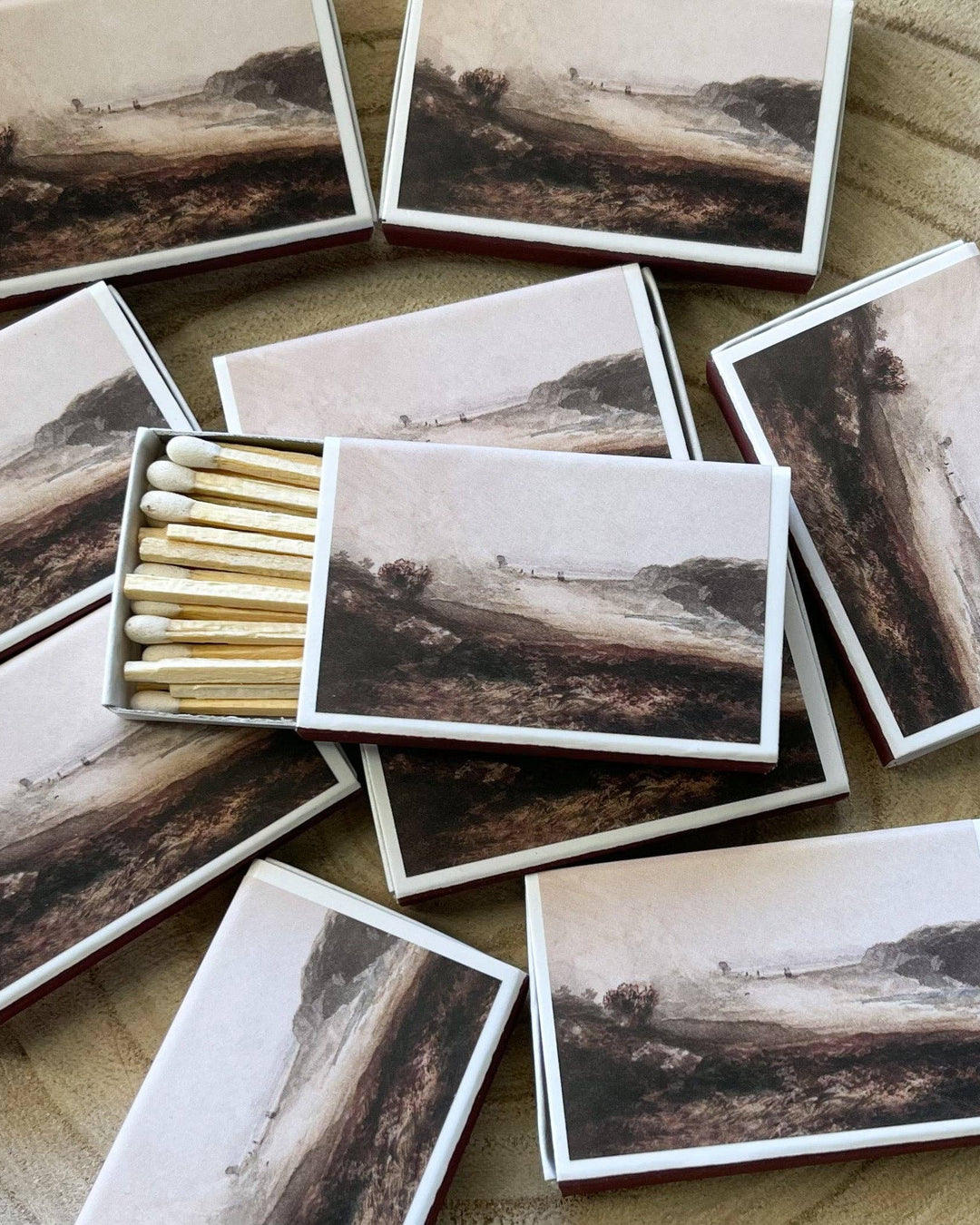 Matches with landscape images on a textured surface