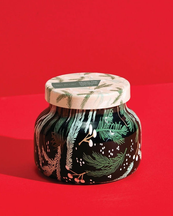 Decorative jar with a lid on a red background