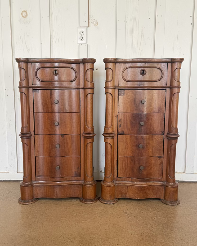 Two wooden nightstands with drawers against a white wall.