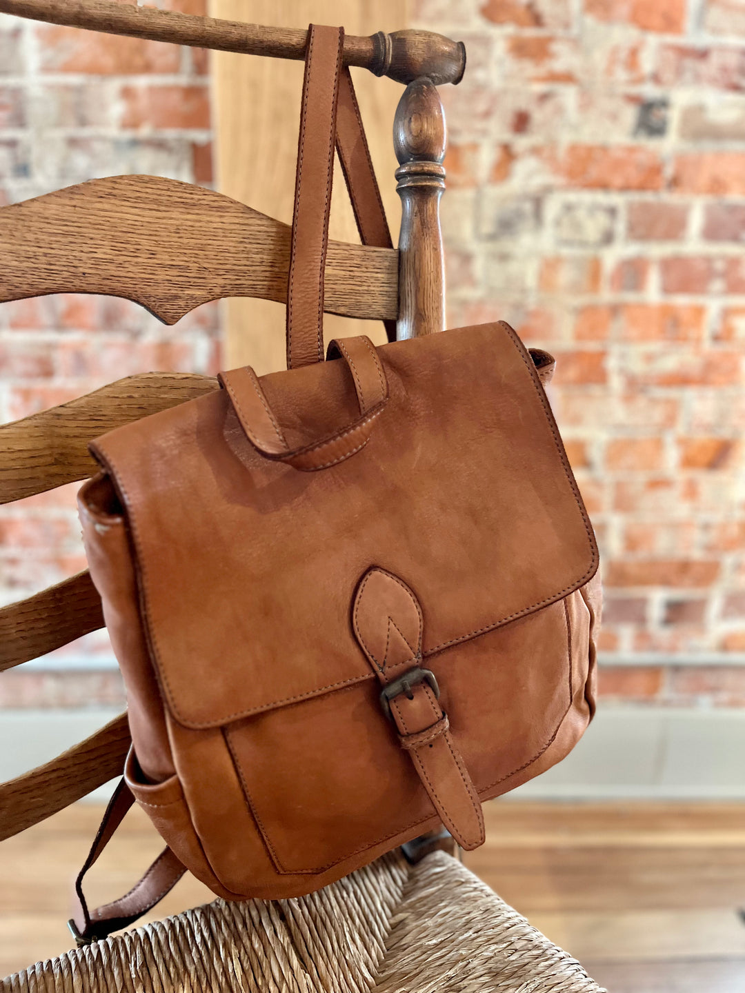 Leather backpack with side 2025 pockets