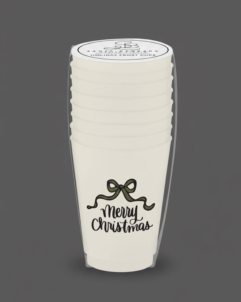 Stack of white paper cups with 'Merry Christmas' text and a bow design, branded 'Sara's Paperie'.