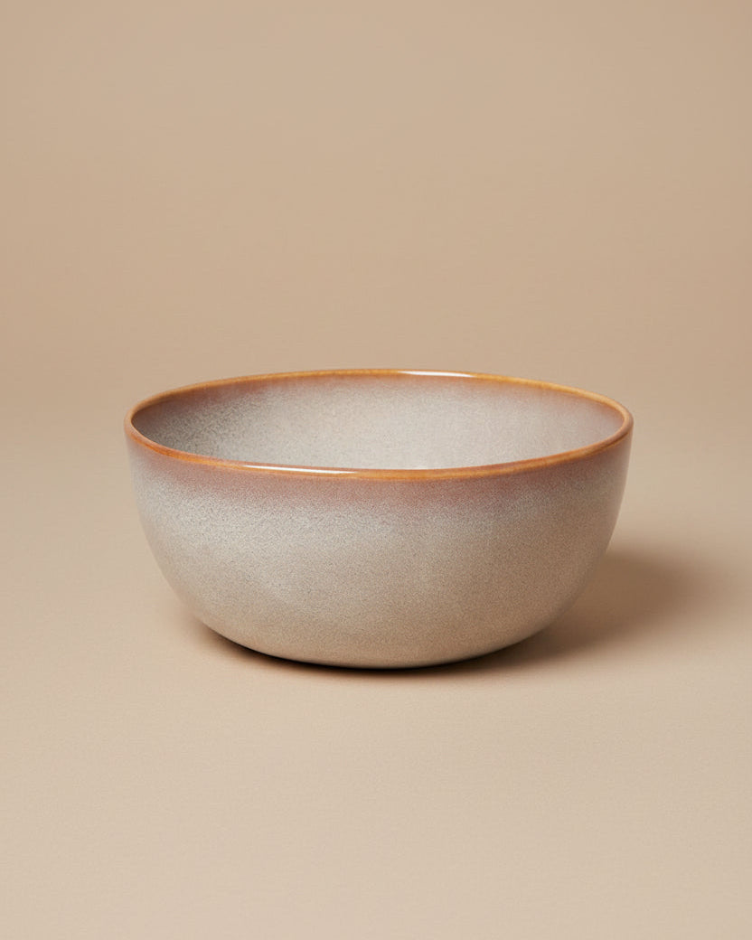 Ceramic bowl with a speckled design on a white background